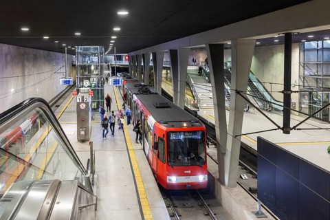 Modern architecture of the Breslauer Platz central railway station light rail station with tram.