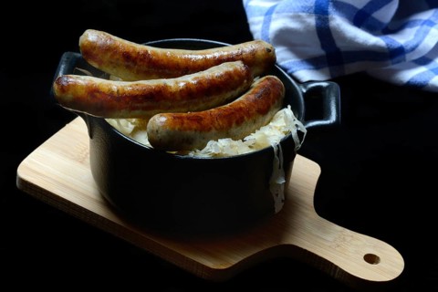 Nuremberg sausages with sauerkraut in a pot, Rostbratwurst, Germany, Europe