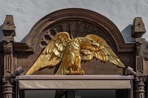Gold-coloured eagle statue at the Hotel Adler, Marktplatz 18, Eichstätt, Upper Bavaria, Germany,