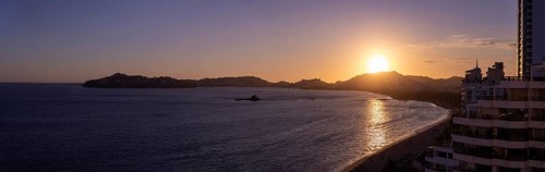 Mexico, Acapulco resort sunset beaches and scenic ocean views near Zona Dorada Golden Beach zone.,