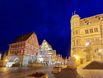 Town hall on the market square and half-timbered houses in Herrngasse in the old town of Rothenburg