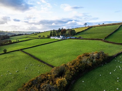Farms over Trecastle from a drone at sunset, Brecon Beacons National Park, Powys, Wales, England,