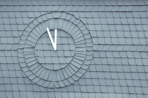 Slate wall with time, five minutes to twelve, symbol, time, clock, clock hand, grey, white,