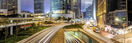 Hong Kong at night traffic with streets and skyscrapers panorama in Hong Kong, China, Asia