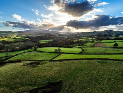 Farms over Trecastle from a drone at sunset, Brecon Beacons National Park, Powys, Wales, England,