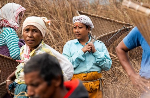 Villagers participate in a community fishing event on the occasion of the Bhogali Bihu festival at