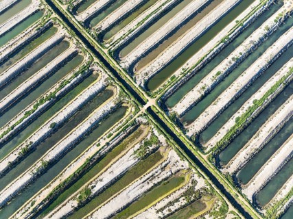Saline ponds at the salt works of Isla Cristina. Aerial view. Drone shot. Huelva province,