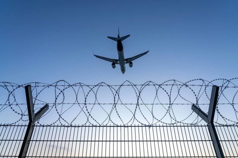 Symbolic image security at the airport, outer fence at Düsseldorf International Airport, steel wire