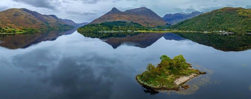Mountains reflected in fjord, coast, island, autumn, cloudy, aerial view, panorama, Loch Leven,