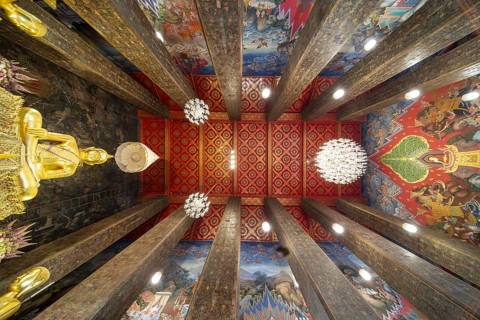 Frog's-eye view: coffered ceiling and golden Buddha statue, Bhumispara-mudra, Buddha Gautama at the
