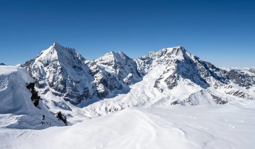 Mountain panorama with snow-covered mountain landscape in winter, view of mountain peaks