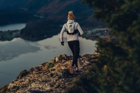 Trail running in autumn on the Jochberg on Lake Walchensee against the wonderful backdrop of the
