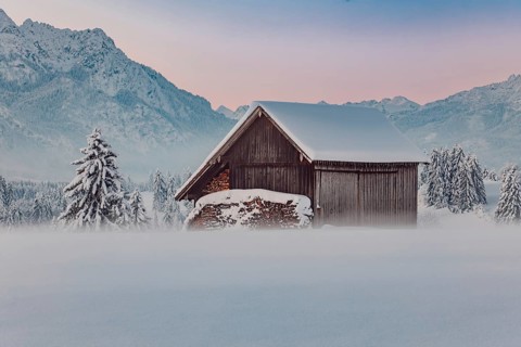 Deep snowy winter morning mood near Halblech in the foothills of the Alps in the Allgäu with the