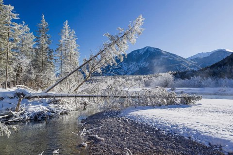 Isar valley in winter at temperatures of minus 18 degrees Celsius. Snow covered landscape with the