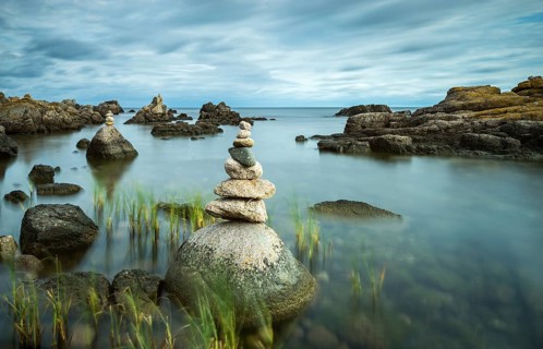 Rocky coast with cairns, Allinge-Sandvig, Bornholm, Denmark, Europe
