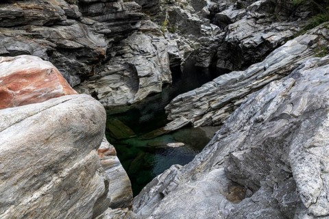 Rocks, granite rock formations in the Maggia River near Ponte Brolla, in the Maggia Valley, Valle