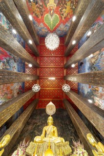 Frog's-eye view: coffered ceiling and golden Buddha statue, Bhumispara-mudra, Buddha Gautama at the
