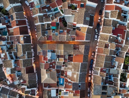 Streets and rooftops in the White Town of Olvera. Aerial view. Drone shot. Cádiz province,