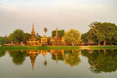 The central Buddhist temple Wat Mahathat in the UNESCO World Heritage Sukhothai Historical Park,