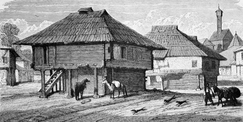 Wooden houses in Bosnian town, a ladder to the dwelling, dogs, horses, packhorse, sandy road, town,