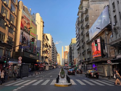 Avenida Corrientes with the obelisk in the city centre in the evening light, Buenos Aires,