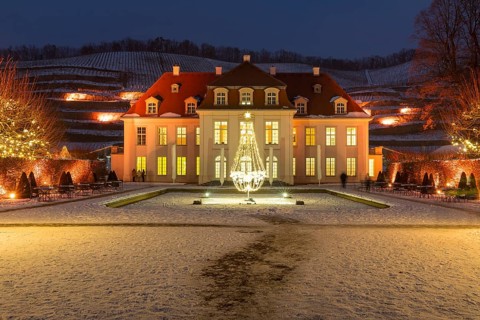Wackerbarth's winter magic, castle and vineyards with Christmas lights and snow, Radebeul, Saxony,