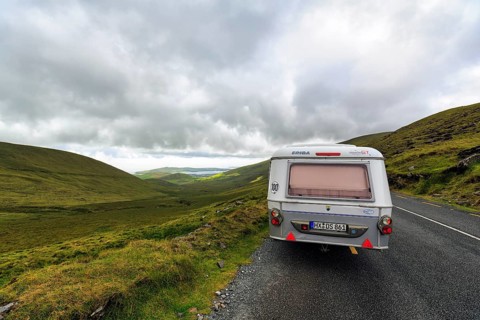 Caravan travelling on Connor Pass, also Conor Pass, to Brandon Bay, coastline, Dingle Peninsula,