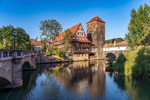 Half-timbered house Weinstadel and water tower on the Pegnitz in Nuremberg, Bavaria, Germany,