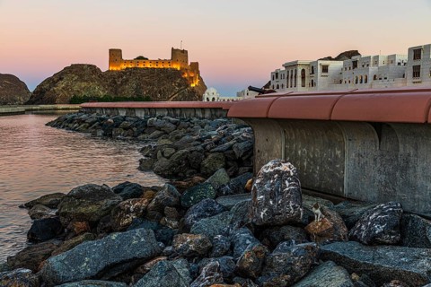 Quay wall at the Sultan's Palace, behind the illuminated photo Al Jalali, Muscat, Arabian