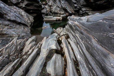 Rocks, granite rock formations in the Maggia River near Ponte Brolla, in the Maggia Valley, Valle