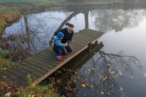 Mother with little son at a bathing jetty in the early morning, Othenstorf, Mecklenburg-Vorpommern,