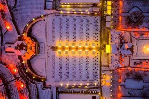 Aerial view of Wackerbarth Castle with castle park, belvedere and vineyards with snow and Christmas