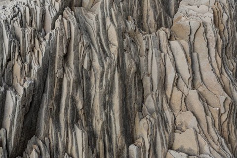 Reynisfjara Beach with Basalt rocks (Stuolabrrg) and the rock needles (Haidrangur), close to Vik i