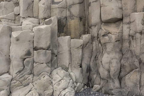 Reynisfjara Beach with Basalt rocks (Stuolabrrg) and the rock needles (Haidrangur), close to Vik i