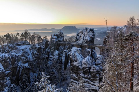Snow-covered Bastei Bridge in the morning, in the background the Lilienstein, Saxon Switzerland,