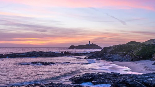 Godrevy Lighthouse, the lighthouse of Godrevy on Godrevy Island in the sea. In the evening at