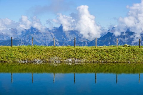 Artificial lake, snow pond, at the mountain station of the Kanzelwand cable car, panoramic view of