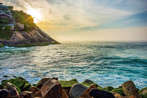 Entrance to the Barra da Tijuca canal seen from the breakwater during sunrise in Rio de Janeiro Rio