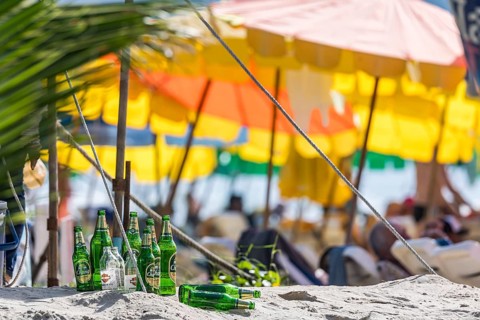 Overtourism in Thailand. Mass tourism on the sandy beach of Patong, the deckchairs are packed