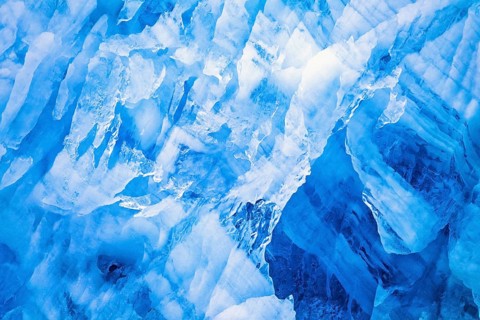 Natural ice patterns on a glacier wall in Arctic, Svalbard, Norway, Europe