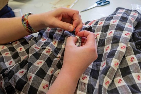 Detroit, Michigan - Volunteers repair various items during the monthly Repair Cafe at the Knapp