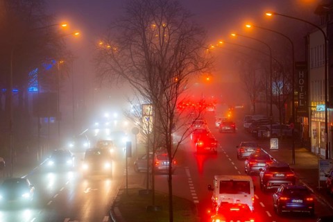 Dense fog, with visibility sometimes less than 100 metres, city centre traffic at rush hour on