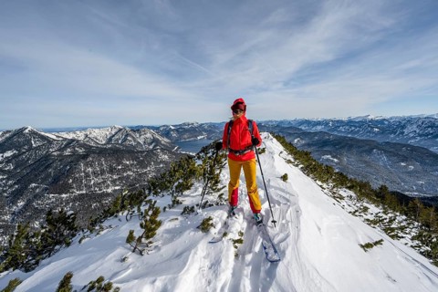 Ski tourer at the summit of Simetsberg, mountain panorama, Estergebirge, Bavarian Prealps, Bavaria