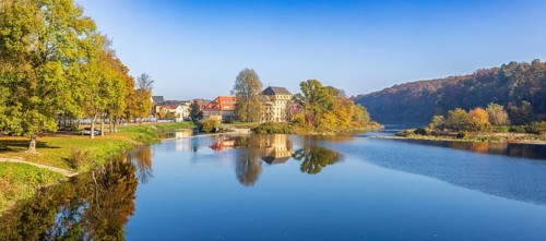 Panorama of the Mulde at the Gattersburg with historic large mill and Mulde weir in autumn, Grimma,