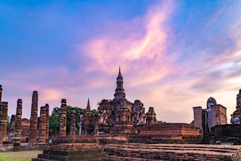 The central Buddhist temple Wat Mahathat at sunset, UNESCO World Heritage Sukhothai Historical