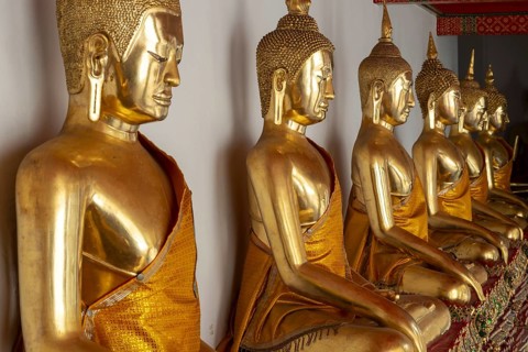 Gilded Buddha statues (Bhumispara-mudra: Buddha Gautama at the moment of enlightenment), Wat Pho,