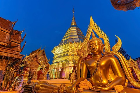 Buddha statue and Golden Chedi of the Buddhist temple complex Wat Phra That Doi Suthep, landmark of