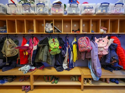 Germany - Symbolic image KITA. Children's coats, jackets and unicorn rucksacks hang on a coat rack