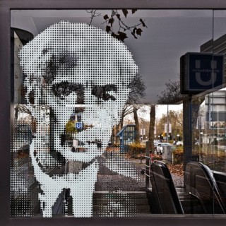 Portrait of Theodor Heuss on the glass pane at the underground exit Heussallee and Museumsmeile,