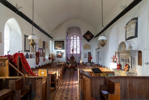 Church of Saint Gregory decorated with Remembrance poppies and wreaths, Hemingstone, Suffolk,